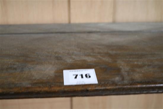 An Edwardian carved oak four shelf wall bracket, W.100cm